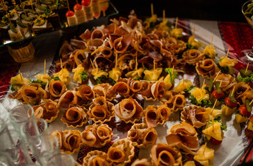 Buffet table of reception with cold snacks, meat and salads