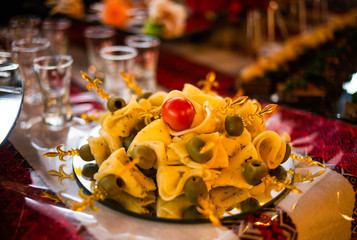 Buffet table of reception with cold snacks, meat and salads