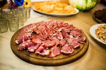 Delicious appetizers with bacon on a banquet table