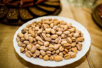 A plate of nuts on a banquet table