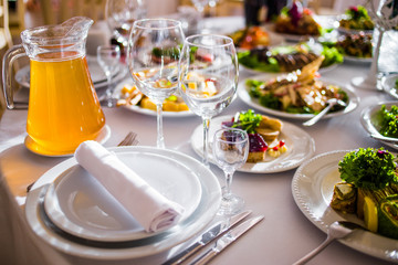 Buffet table of reception with cold snacks, meat and salads
