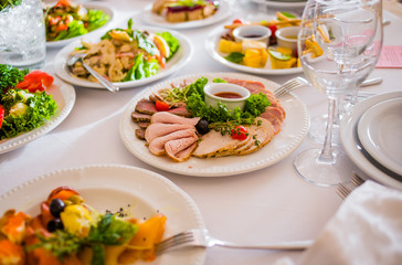 Appetizers and salads on the banquet table