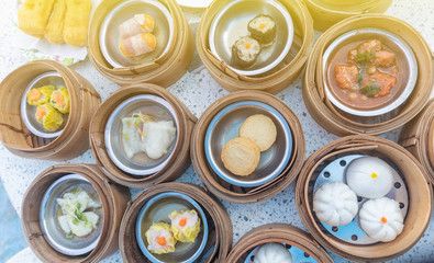 close up of variety dim sum in bamboo basket