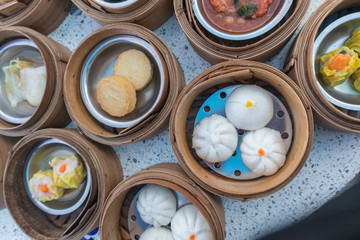 close up of variety dim sum in bamboo basket