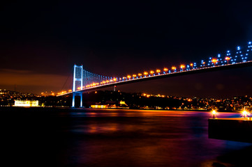 Fototapeta na wymiar Istanbul Bosphorus Bridge at night. 15th July Martyrs Bridge. Istanbul / Turkey.