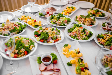 Appetizers and salads on the banquet table