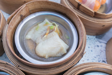 close up of variety dim sum in bamboo basket