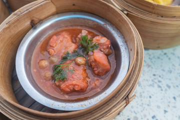 close up of variety dim sum in bamboo basket