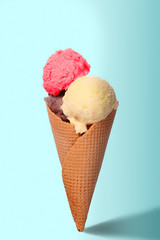 Ice cream cone with three different scoops of ice cream