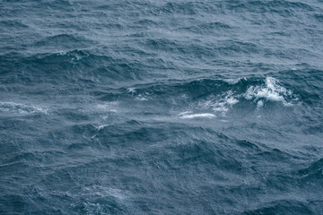 Sea surface with waves and tide aerial view background