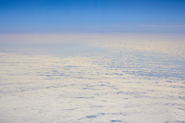Photos of clouds from a height. Cloudy sky. Beautiful clouds in the blue sky. Clouds in clear weather. Sky texture The texture of the clouds. The texture of the earth. View of the ground from a height