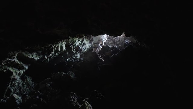 Astronaut getting out a Martian cave, Mauna Loa Volcano, Hawaii
