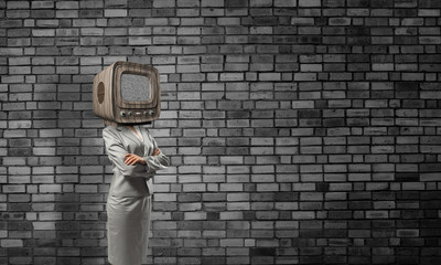 Business woman with old TV instead of head.