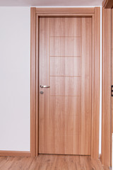 Wooden doors in the empty room. 