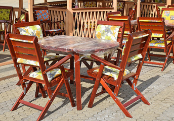 Wooden outdoor chairs and tables