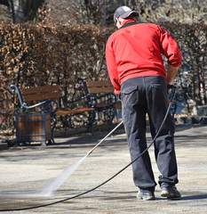 Street cleaner at work on the road
