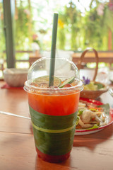 Lemon tea with food on table.