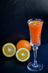 glass of juice with orange and ice