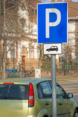 Parking lot sign on the road