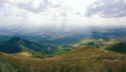 Fototapeta na wymiar Large panorama view from the mountain Beshtau, summer sunny day near Pyatigorsk