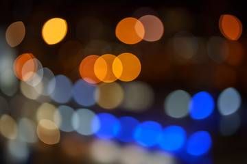 Abstract blurred blue, orange and yellow bokeh lights background