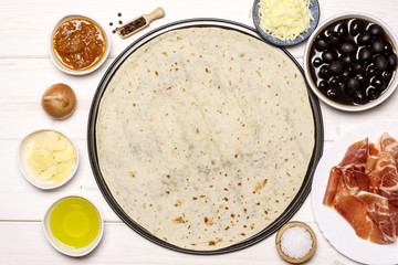 Set of ingredients. recipe step by step pizza capricciosa flatlay on white wood