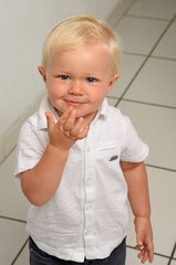 blond child with a white shirt