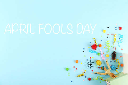All fools day background concept with holiday accessories, April 1st themed party attributes. Close up, copy space, top view, flat lay.