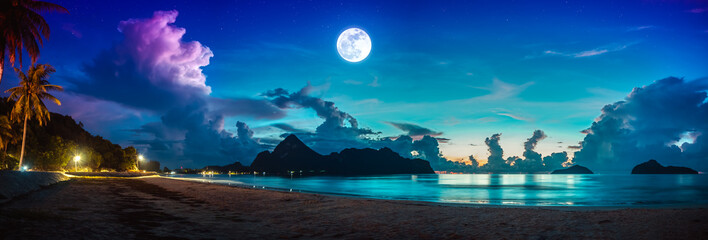 Colorful blue sky with cloud and bright full moon on seascape to night