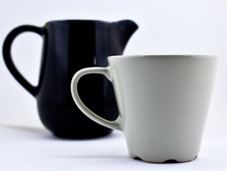 Ceramic coffee mug and milk pot