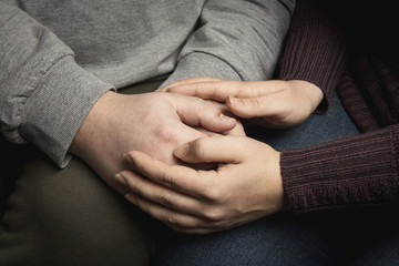 Woman hands holding man hands, couple lifestyle, wife supports her husband in trouble. Sharing and giving hope