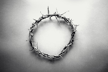 Moody black and white image of crown of thorns like Jesus Christ wore with drops of blood on tips...