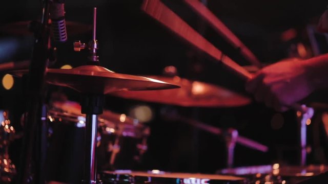 School of Music. Drummer in a jazz orchestra playing chopsticks on drums