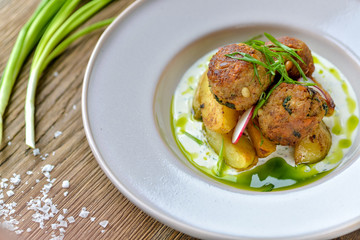 chicken with rice and vegetables on white plate