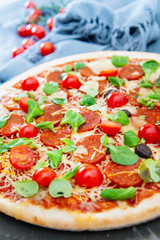 Sausage Pizza with Ham and tomatoes