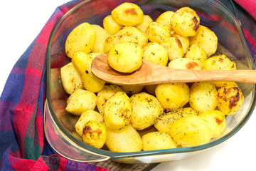 Naklejka na ściany i meble The baked potatoes in a baking tray close-up