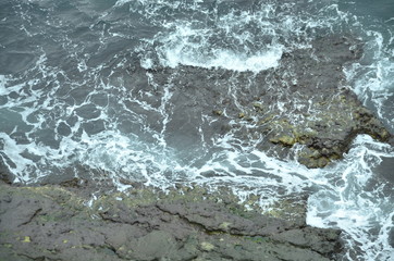 waves crashing on rocks