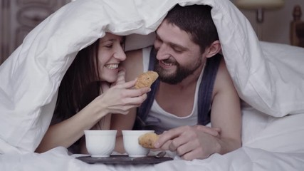 breakfast with coffee and fresh croissants, on table, happy couple on the morning - Powered by Adobe