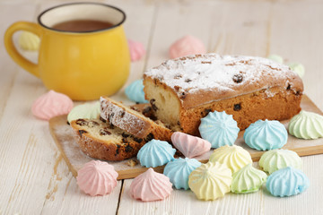Delicious homemade cake with raisins on a light wooden background. close-up. rustic. copy space.