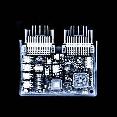 X-ray image of engine control unit or ECU in Motorcycle is a type of electronic control unit that controls a series of actuators on an internal combustion engine to ensure optimal engine performance.