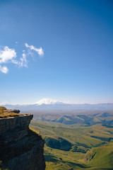 Fototapeta na wymiar View of the snow Elbrus in summer