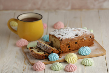 Delicious homemade cake with raisins on a light wooden background. close-up. rustic. copy space.