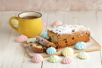 Delicious homemade cake with raisins on a light wooden background. close-up. rustic. copy space.