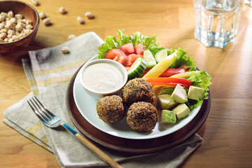 Fried falafel balls served with fresh vegetables