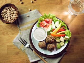 Fried falafel balls served with fresh vegetables
