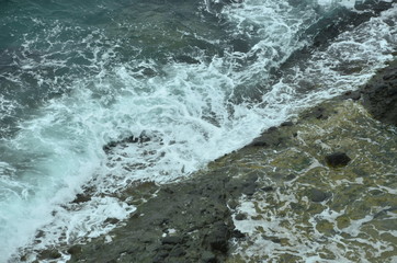 waves crashing on rocks