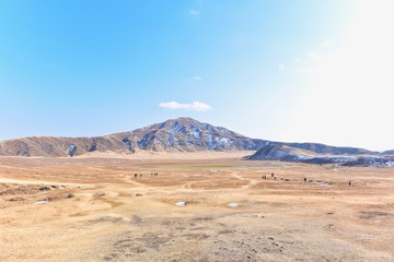 Fototapeta na wymiar Vast Landscape of Kusasenri Plateau in Mount Aso