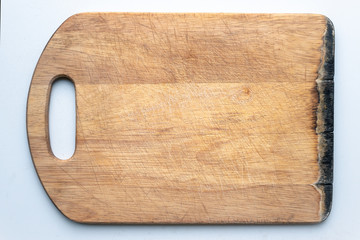 beautiful wooden board for cutting. kitchen board on a white background. kitchen board on the windowsill. start cooking