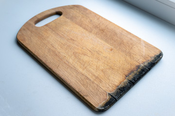 beautiful wooden board for cutting. kitchen board on a white background. kitchen board on the windowsill. start cooking
