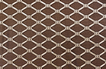 Diamond-shaped lattice on a brown background. Background for design and decoration.